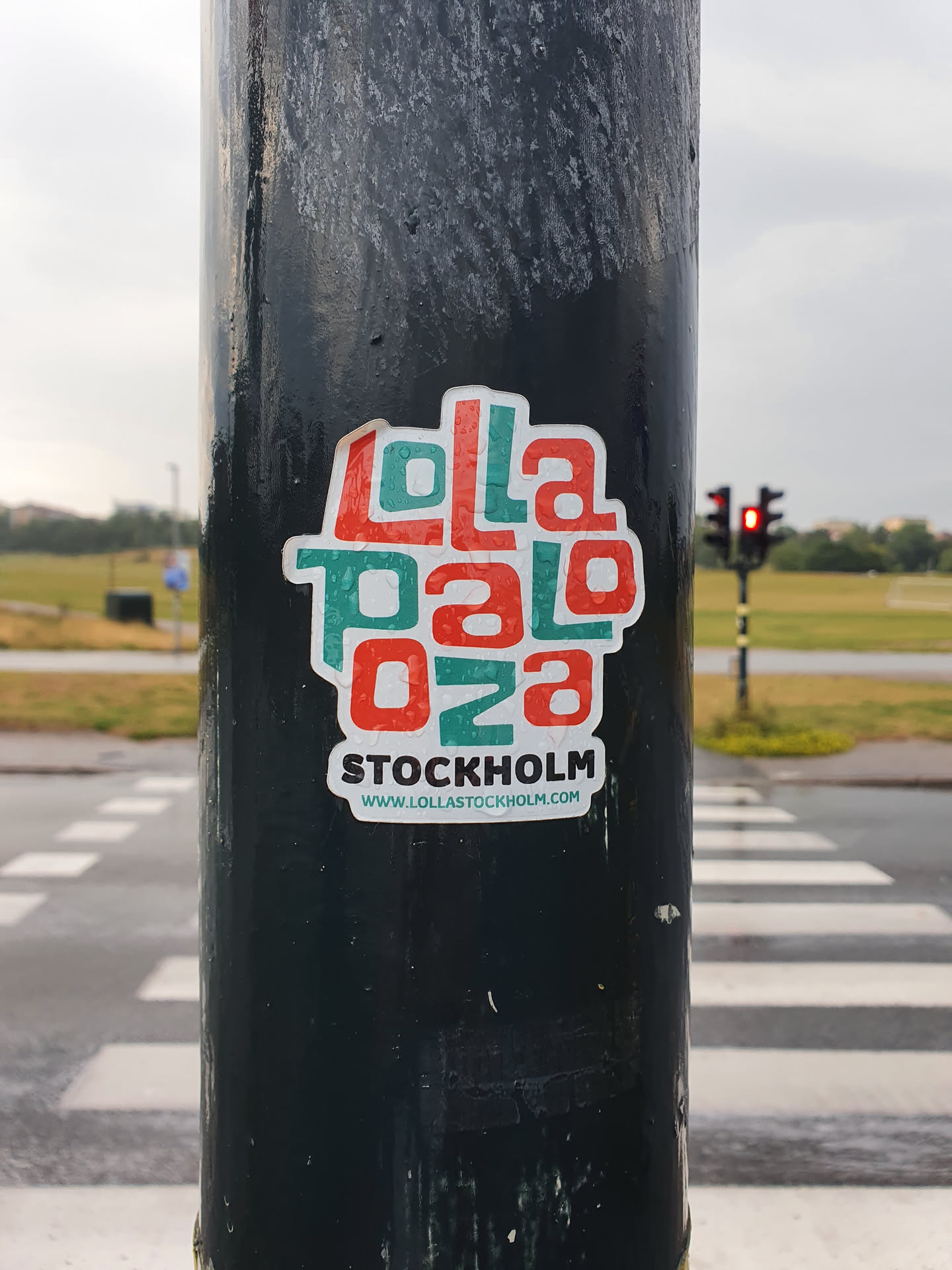 A sticker featuring the Lollapalooza Stockholm logo.  The text on the sticker says "Lollapalooza" in a stylized font with the numbers "028" below it, and "STOCKHOLM" below that.  A website address is printed below the text: www.lollastockholm.com