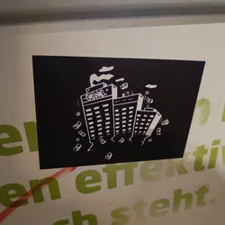 Black and white sticker depicting three buildings with money falling from them. The word Gangs is written on the top of one of the buildings. It has a dark and gritty style.