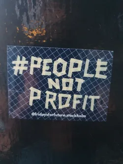A sticker with the text '#PeopleNotProfit' and the social media handle @fridaysforfuture.stockholm. The text is written in a stylized font and appears to be made of tape.