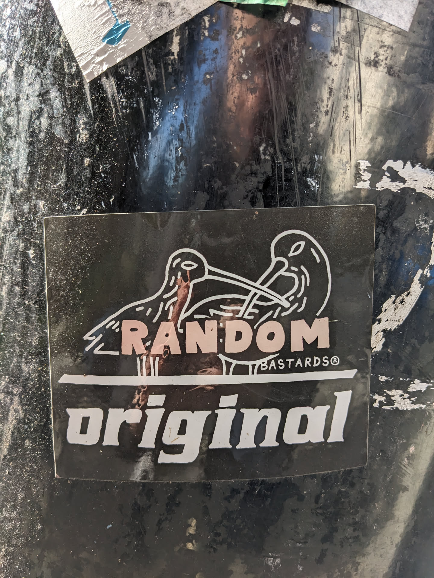 Black and white sticker with two birds facing each other and the text "RANDOM BASTARDS®" and "original".