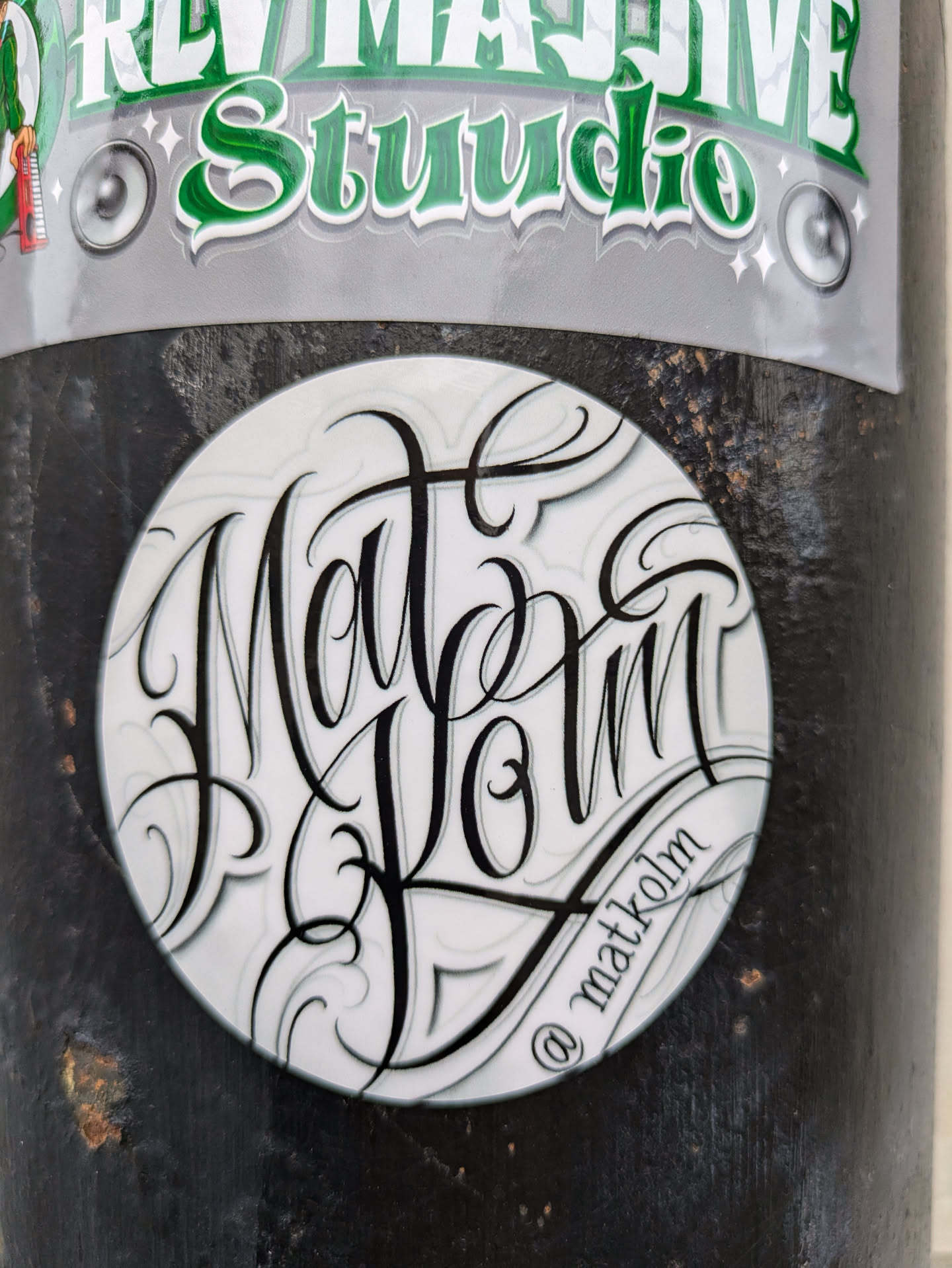 Round sticker with black lettering on a white background. The lettering says "Matt Kolm" in a stylized script font.  There's a small @matkolm signature at the bottom.