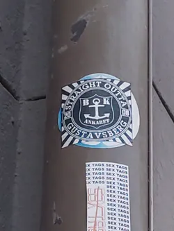 Round sticker with a crest in the middle. The crest contains an anchor and the letters BOK. The text around the crest says "Straight Outta 2008 Gustavsberg".