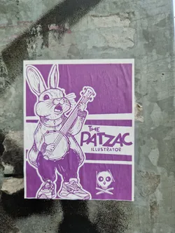 Purple sticker featuring a rabbit playing a banjo. The artist's name, "The Patzac Illustrator," is printed at the top. A skull and crossbones symbol is also present.