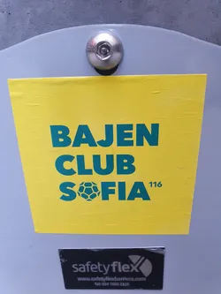 A yellow sticker with the text "BAJEN CLUB SOFIA 116" in green. There is a soccer ball icon between "CLUB" and "SOFIA".