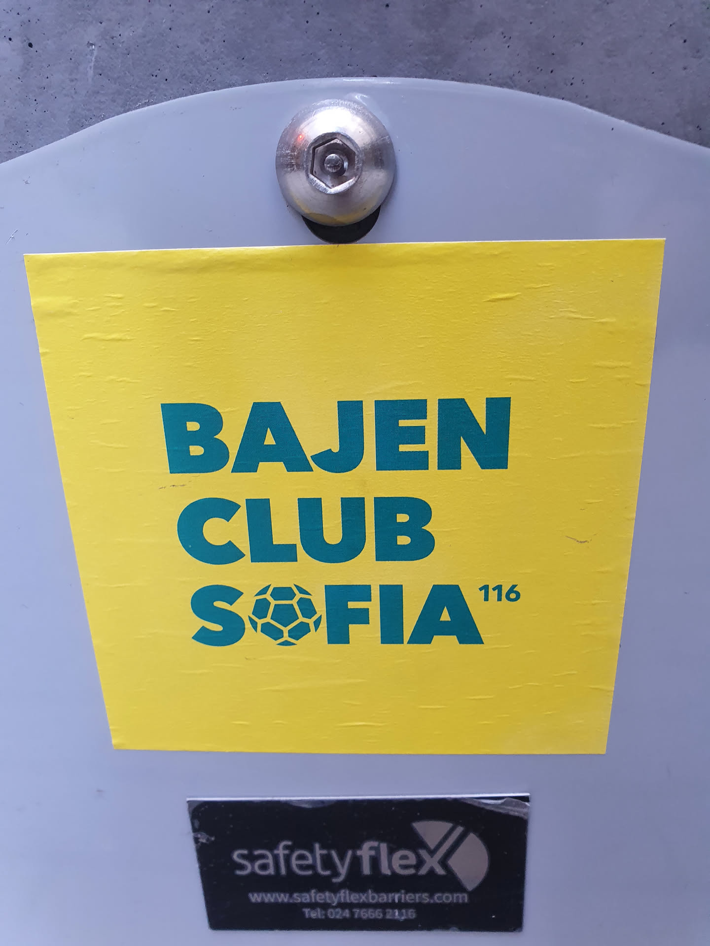 A yellow sticker with the text "BAJEN CLUB SOFIA 116" in green. There is a soccer ball icon between "CLUB" and "SOFIA".