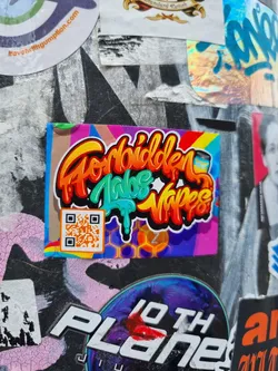 A colorful sticker with graffiti-style text that says "Forbidden Vape Vibes." It features a QR code and a honeycomb pattern. The sticker is vibrant and eye-catching.