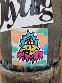 This is a small, square sticker featuring a unique cartoon character. The character has a yellow, triangular head with three eyes and an angry expression. It's wearing a pink collar that looks somewhat melted or dripping. The background is soft pastel colors in teal and orange and shows rain droplets.