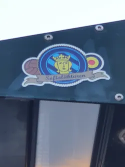 A sticker featuring a crest with a crowned woman's face, along with imagery of sports balls. The text 'Sofialightharen' is visible on a banner below the main emblem.