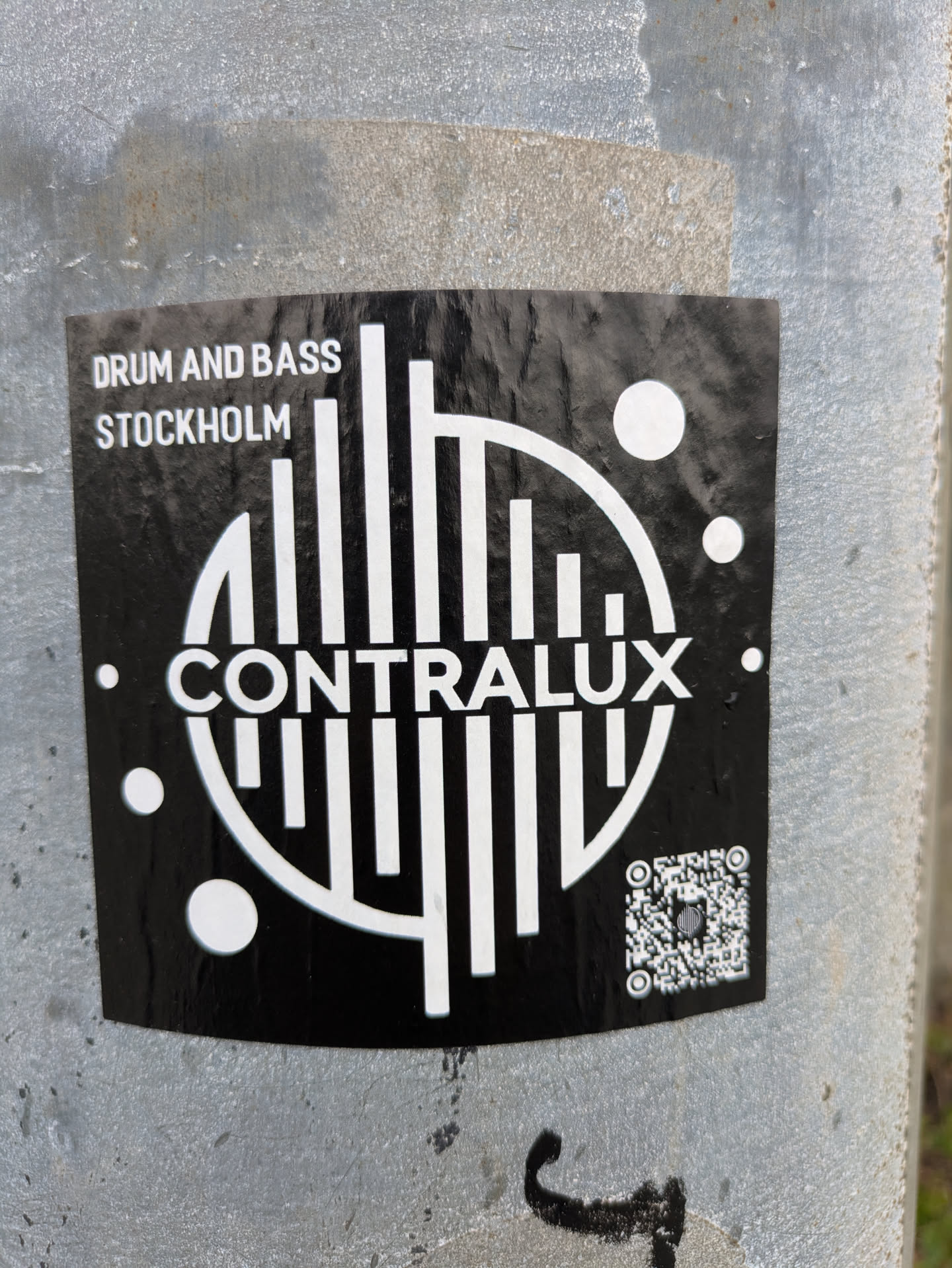 This sticker features the CONTRAUX logo in white against a black background. The logo is composed of vertical bars arranged in a semi-circle, creating a sound wave or equalizer effect. Above the logo, 'DRUM AND BASS STOCKHOLM' is printed in a smaller font. There is a qr code on the bottom right.