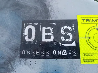 Black and white sticker with the text OBSESSIONALS. The letters OBS are larger and stylized in a distressed font. The word OBSESSIONALS is printed below in a smaller, more uniform font.