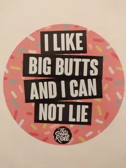 Round sticker with a pink background and colorful sprinkles.  The text 'I LIKE BIG BUTTS AND I CAN NOT LIE' is written in black bold letters on the sticker. The logo 'The Good Roll' is also visible at the bottom.