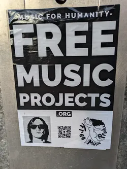 A sticker promoting Free Music Projects, an organization dedicated to providing free music. The sticker features a QR code, a logo with a woman dancing, and a portrait of a person wearing sunglasses.