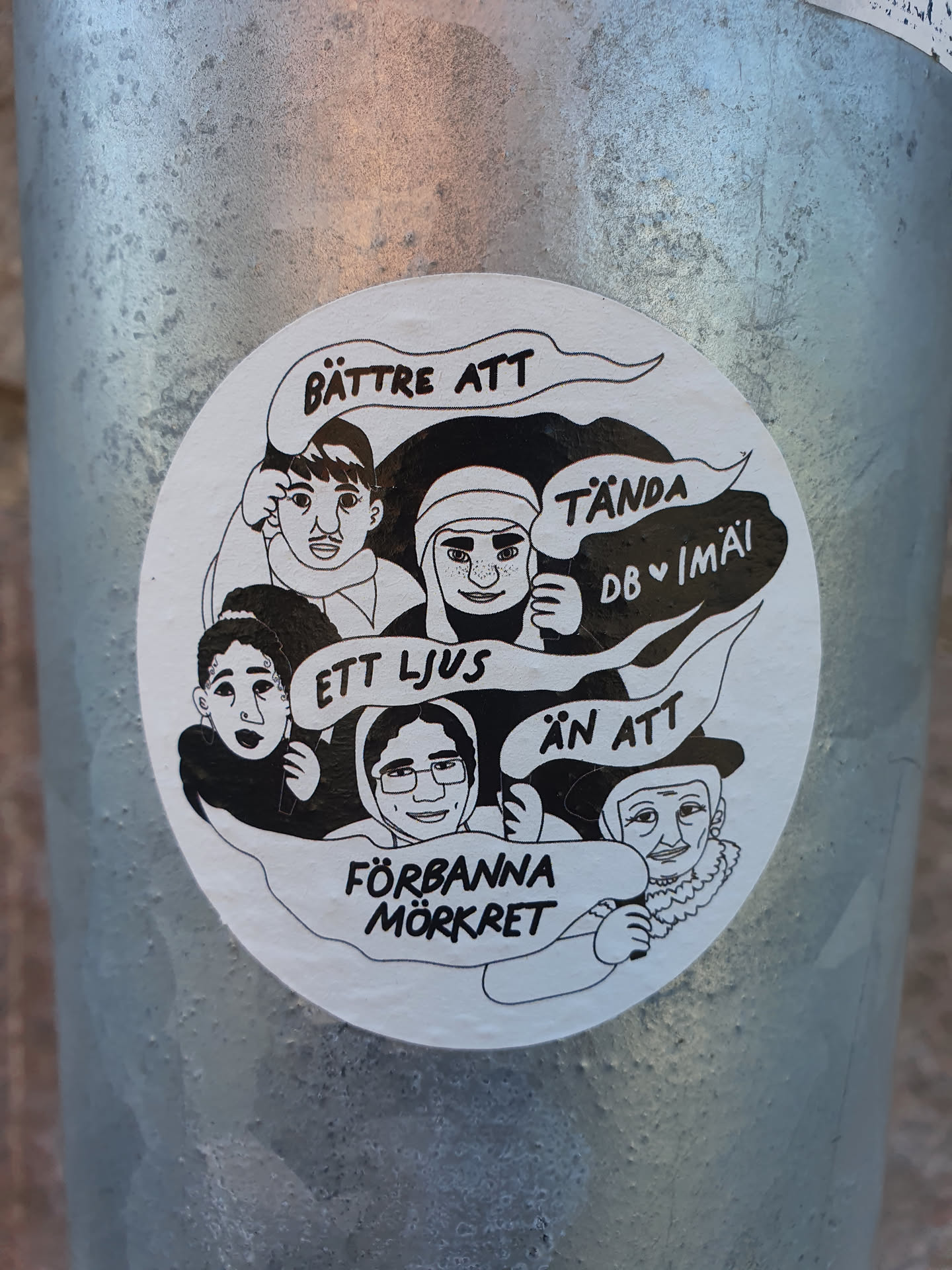 A sticker with a illustration of four people, with text in Swedish. The text translates to:
"Better to light a candle than to curse the darkness"