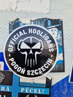 A round black and white sticker with a skull in the center and the text "OFFICIAL HOOLIGANS - POGON SZCZECIN" around it.
