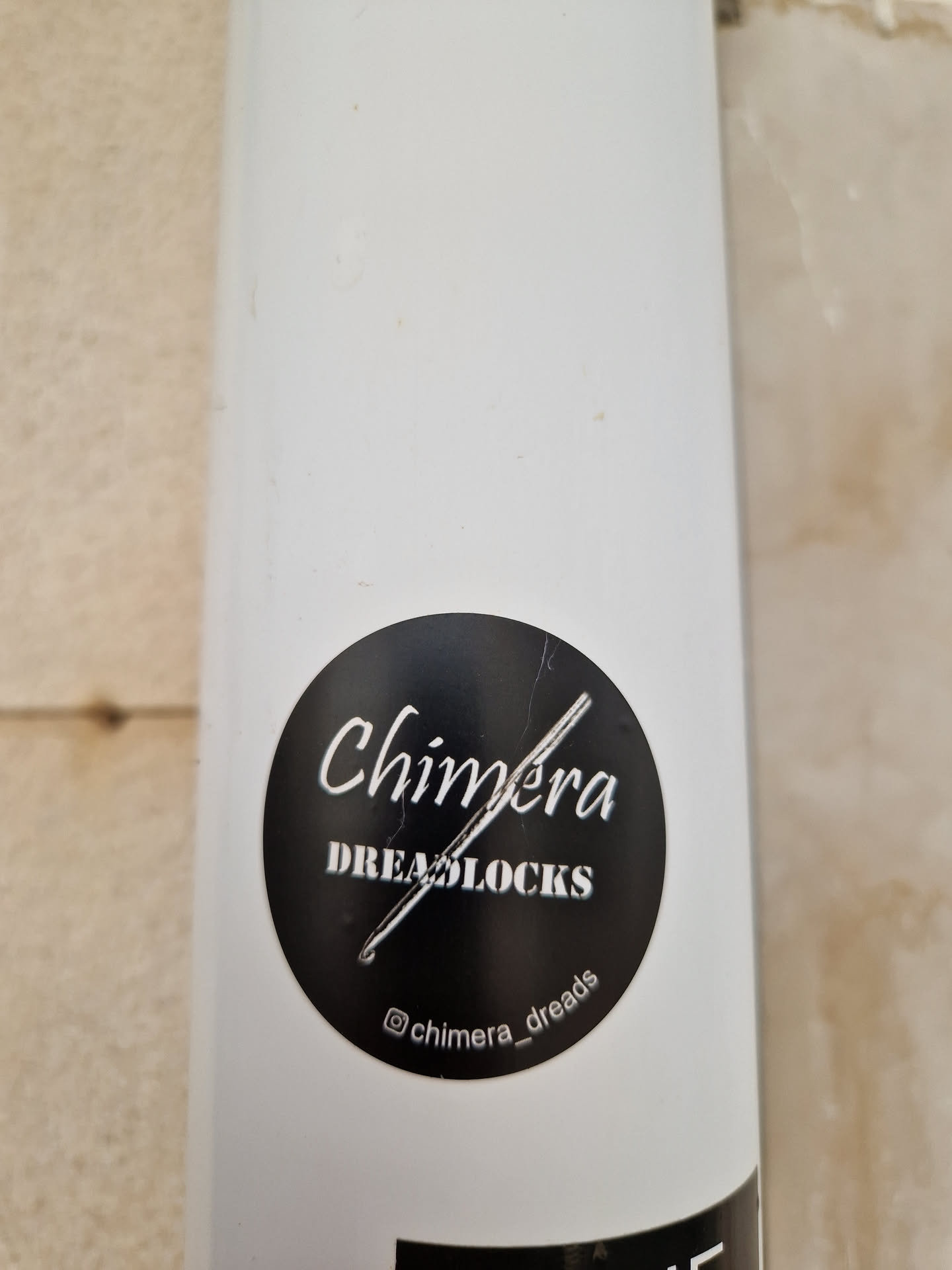 A black and white circular sticker with the text "Chimera DREADLOCKS" and a small crochet hook image. The Instagram handle @chimera_dreads is also visible at the bottom.