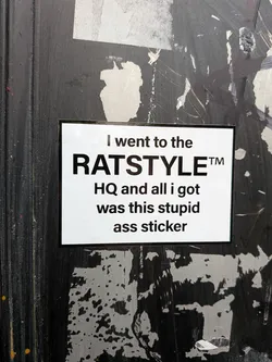 A rectangular sticker with a white background and black text. The text is arranged in several lines. The top line reads 'I went to the'. The second, largest line reads 'RATSTYLE™'. The third line reads 'HQ and all i got'. The fourth line reads 'was this stupid'. The bottom line reads 'ass sticker'. The sticker has a thin black border.