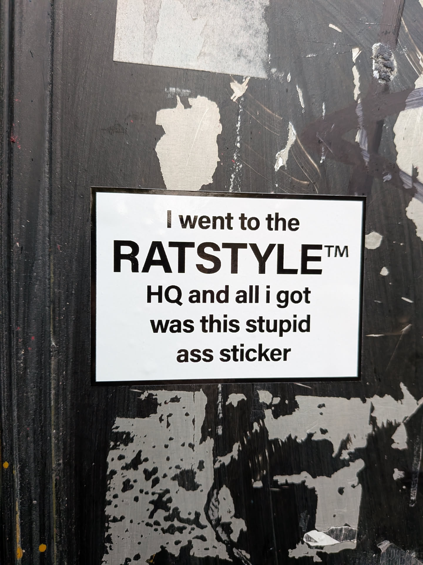 A rectangular sticker with a white background and black text. The text is arranged in several lines. The top line reads 'I went to the'. The second, largest line reads 'RATSTYLE™'. The third line reads 'HQ and all i got'. The fourth line reads 'was this stupid'. The bottom line reads 'ass sticker'. The sticker has a thin black border.