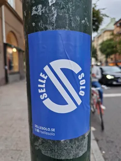 A blue sticker with a white logo that says SelleSolo.  The website and social media handles are listed at the bottom. The logo is a stylized 'S' inside a circle.