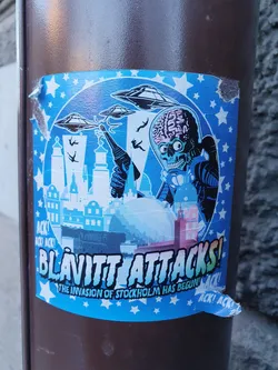 A sticker featuring a Mars Attacks illustration attacking Stockholm. The style is reminiscent of the 1960s Mars Attacks trading cards.