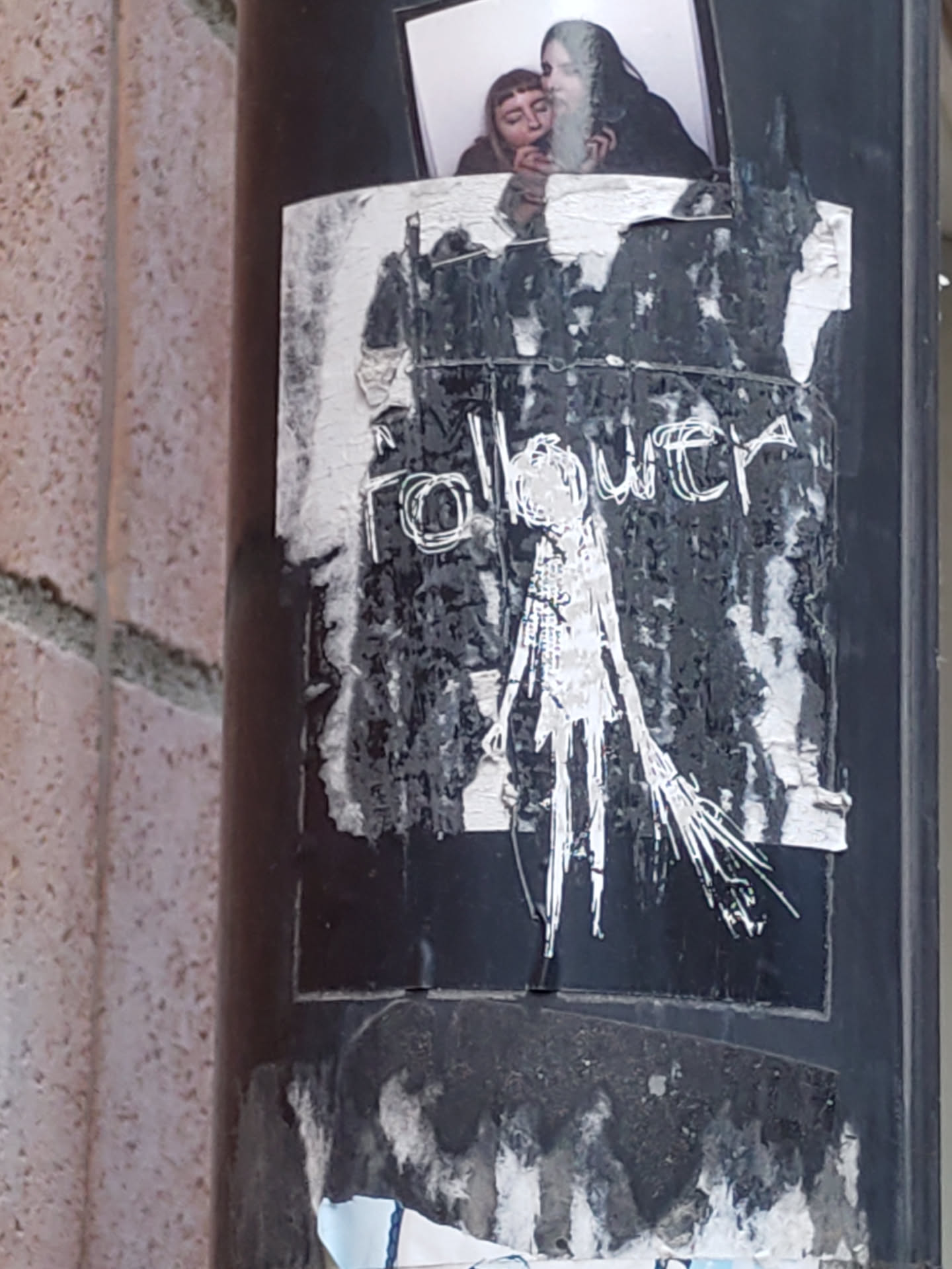 Black and white sticker with a drawing of a figure and the word "follower" written above it. The sticker is partially damaged and looks weathered.