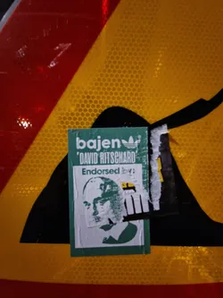 Green sticker featuring a portrait of 'David Ritzchard', endorsed by 'bajen'. The sticker has a stylized Adidas logo next to the 'bajen' text.