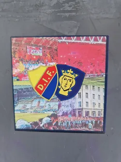 A collage sticker featuring the logos of D.I.F. football club, images of the stadium and fans. The sticker uses a combination of the club's crest and images that represent their history and fans.