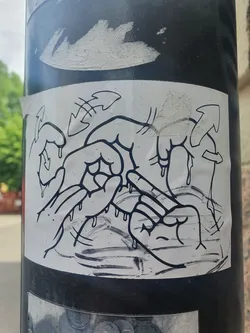 Black and white sticker with a drawing of melting hands. The style is reminiscent of graffiti art.