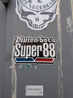 A die-cut sticker set against a grey background. At the top, the words 'Pluton Svea' are written in an ornate gothic blackletter font in white with a black fill. Below, the words 'Super 88' are displayed in prominent, tall, condensed white typography against a solid black rectangular area. Beneath the text are two slanted rectangular badge bars: a glossy blue bar on the left and a glossy red bar on the right, framed by silver-white accents, evoking vintage motor or fuel emblem branding.