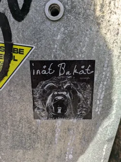 Black and white sticker with a roaring animal face.  Text reads 'inät Bakät records' at the top and 'Sal per slovare il core' at the bottom.