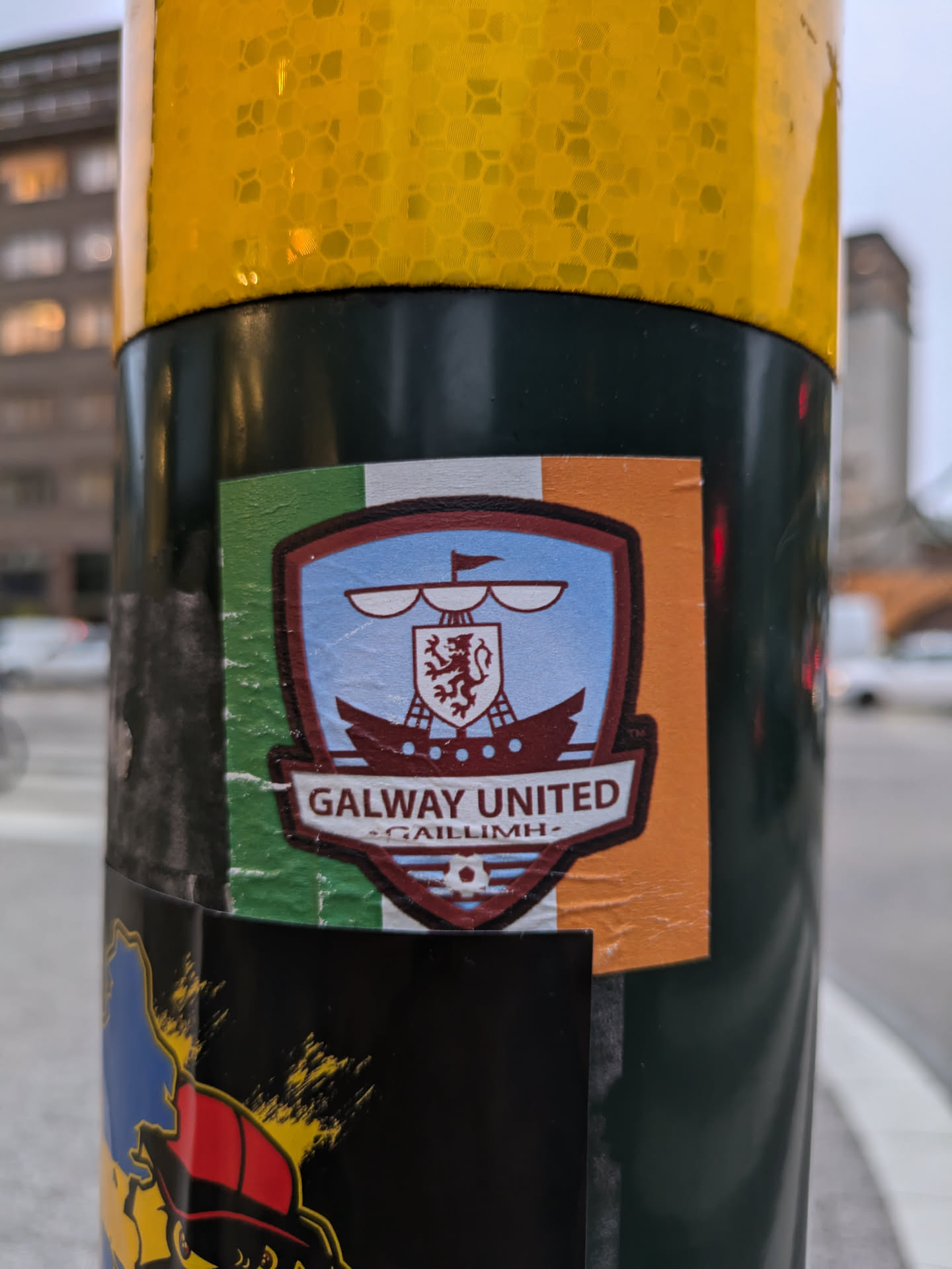A sticker featuring the logo of Galway United Football Club. The logo depicts a ship with a lion emblem, set against the Irish tricolor.  The text 'Galway United' and 'Gaillimh' (Irish for Galway) is clearly visible.