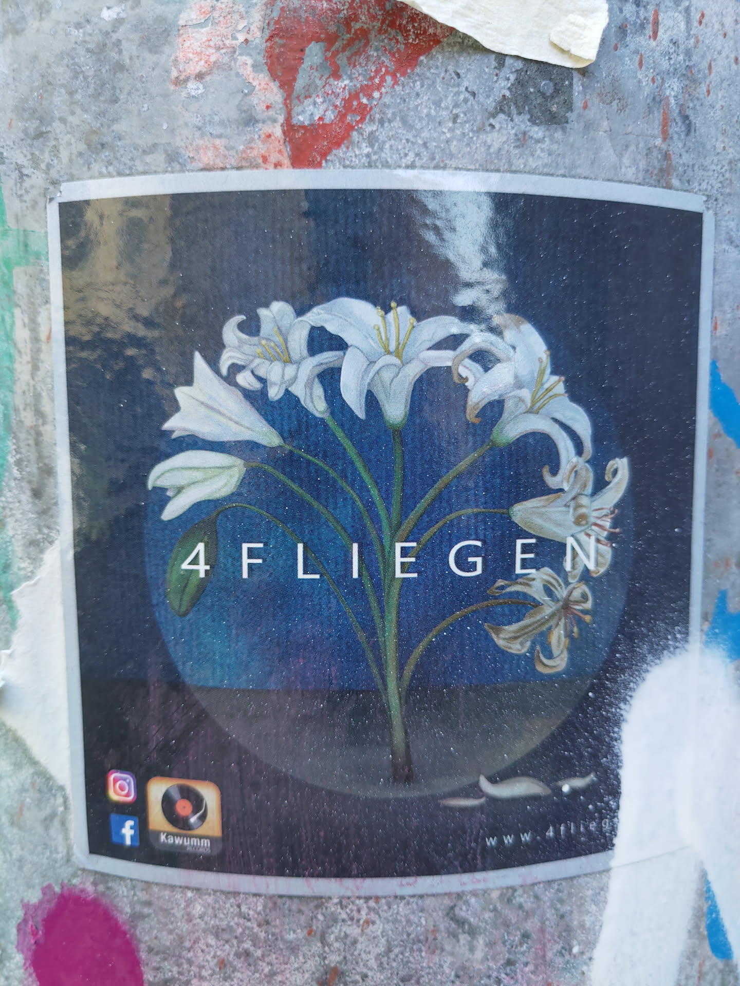 Sticker featuring album artwork of white lilies on a dark background.  The text '4FLIEGEN' is prominently displayed. Social media links for Instagram and Facebook are included. 