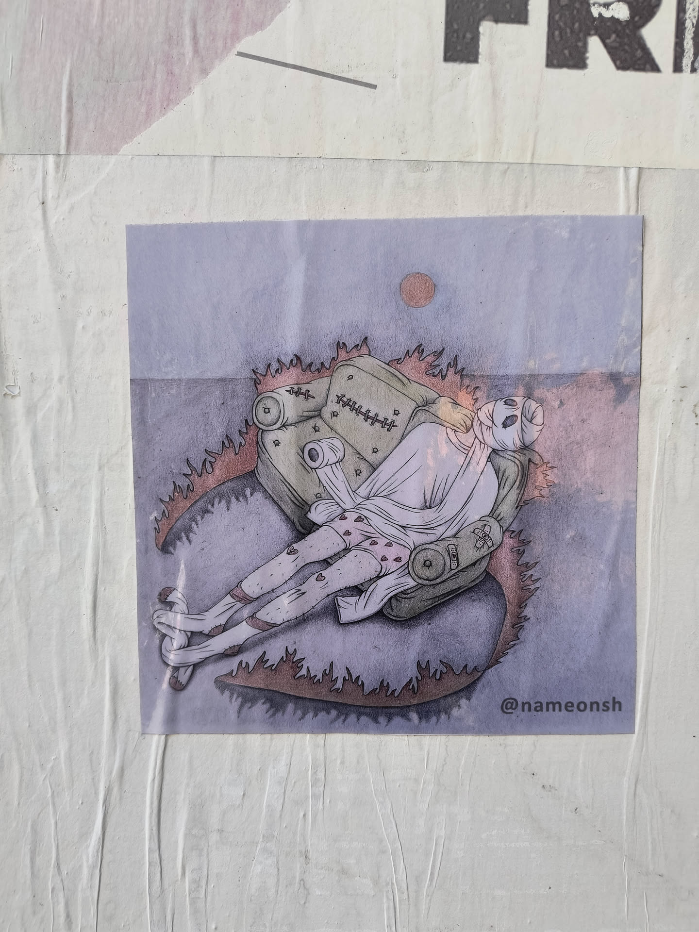 A sticker featuring a person resting on a peculiar, stitched couch, set against a muted background. The art style is illustrative, with a soft color palette and visible texture.