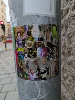 This sticker is a collage of different images, including portraits, objects, and scenes. It seems to be a collection of found images and has a vintage or repurposed feel.