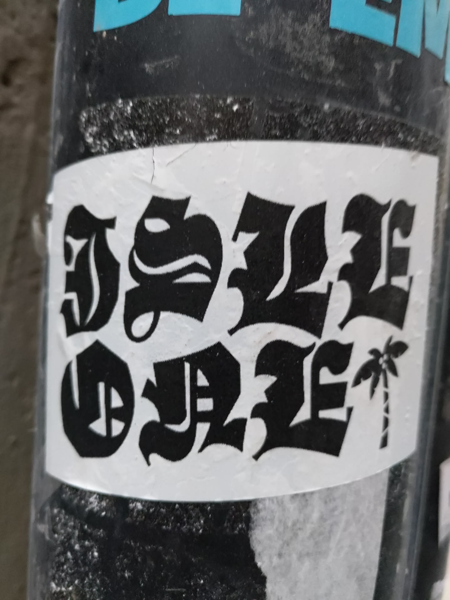 Black and white sticker with a palm tree and the text "Dope style" written in a gothic style font. 