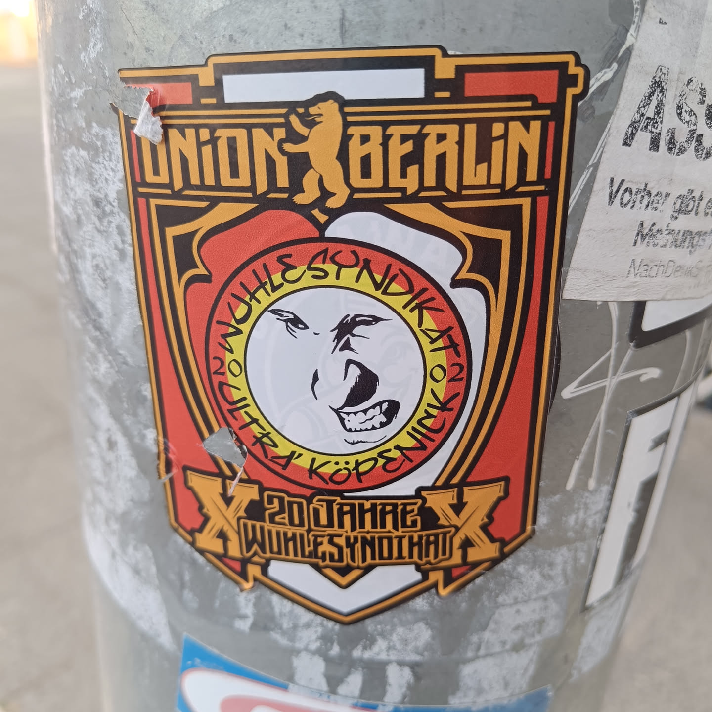 A sticker commemorating 20 years of Wuhlesyndikat, a Union Berlin fan club. The design features the Union Berlin logo and a stylized bear face.