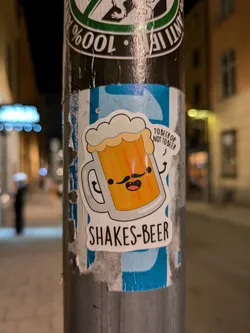 A cute cartoon beer mug sticker with a mustache.  The text on the sticker says "Shakes-Beer" and a smaller text says "To beer or not to beer".