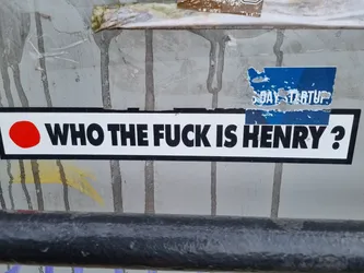 Street sticker A sticker with a bold, provocative question. The sticker features a red circle on the left and black text on a white background.  A partially visible sticker above it says "5Day Startup."
