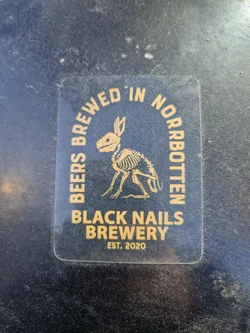 A sticker from Black Nails Brewery, established in 2020, showcasing a unique design with a rabbit skeleton illustration.  The text on the sticker reads 'BEERS BREWED IN NORRBOtten' in an arc above the image, and 'BLACK NAILS BREWERY' and 'EST. 2020' below.