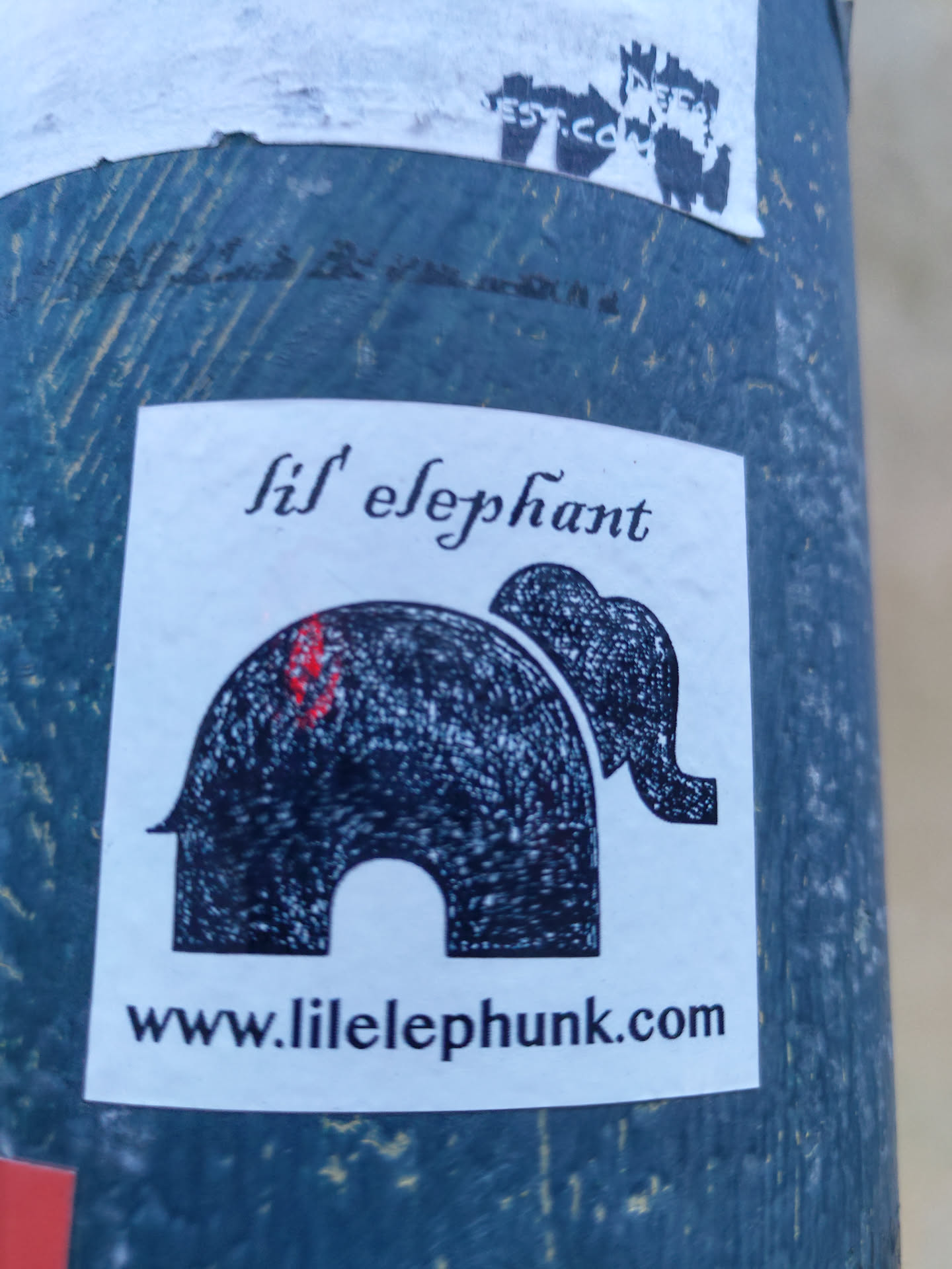 A sticker featuring a stylized illustration of an elephant with the text 'lil' elephant' and a website address: www.lilelephunk.com