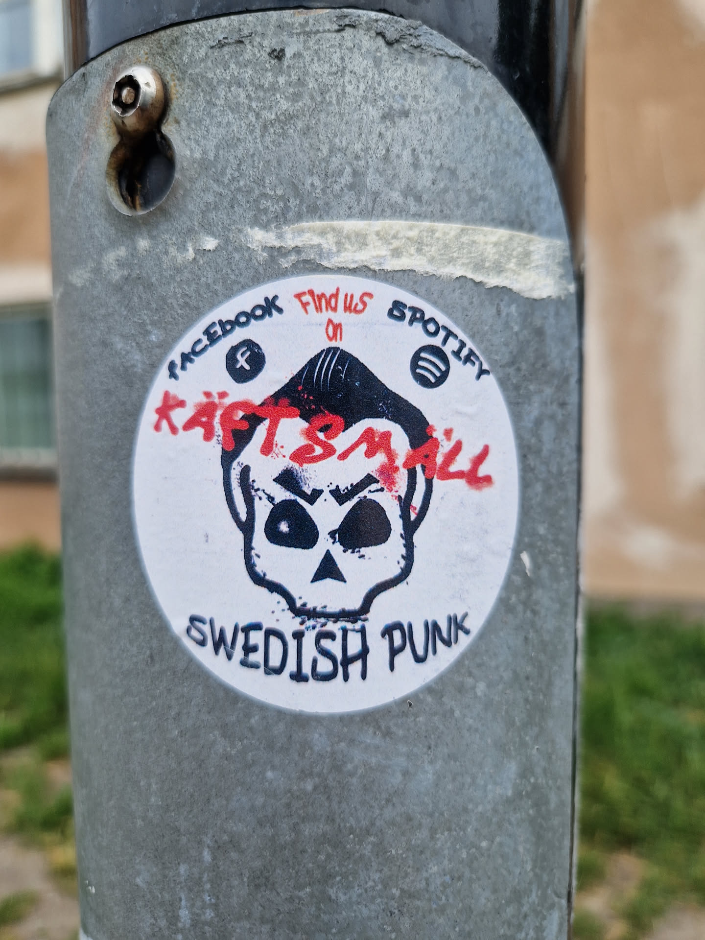 A round sticker featuring a skull illustration with the band name "Kaftsmall" and the words "Swedish Punk".  Social media links for Facebook and Spotify are also included.