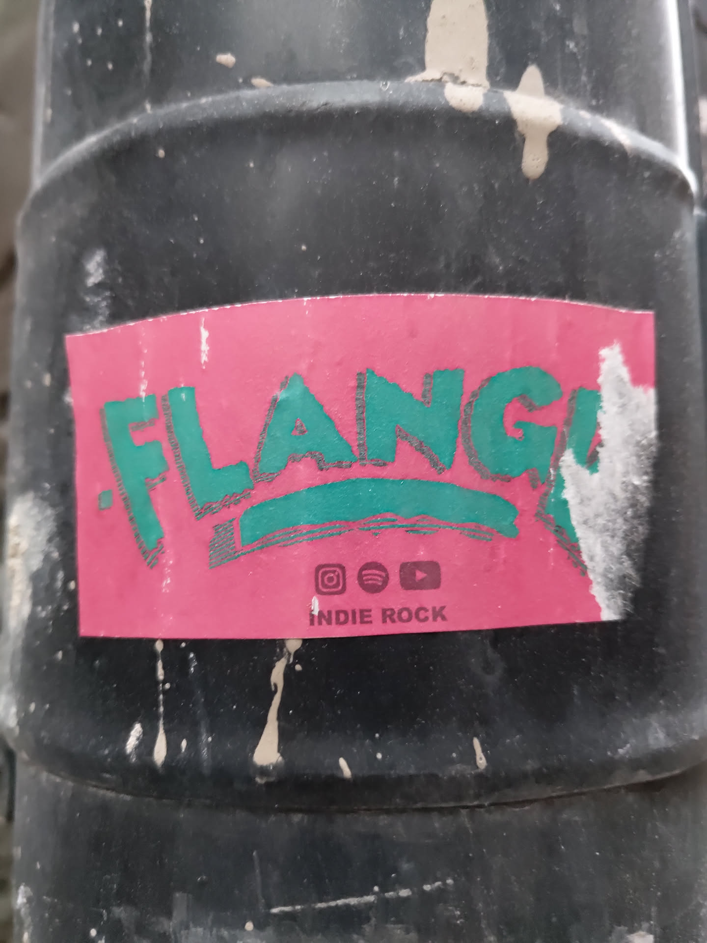 Pink and teal indie rock band sticker with social media icons.