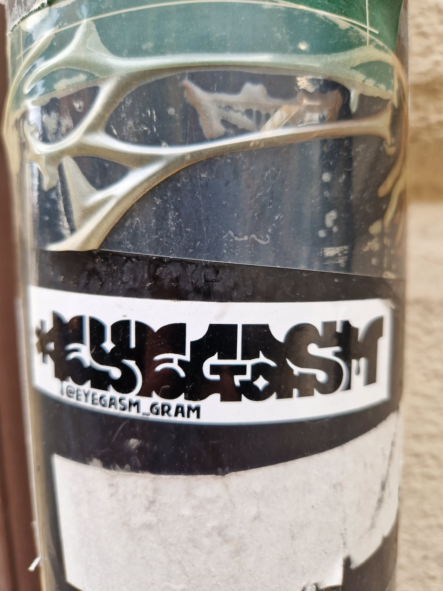Black and white sticker with the word "Eyegasm" stylized in bold, uppercase letters.  The Instagram handle @eyegasm_gram is visible below the main text.