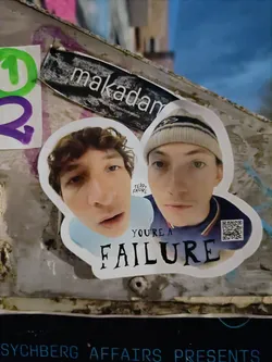 A sticker featuring two young men with the text "YOU'RE A FAILURE" below them.  There is a QR code in the bottom right corner.