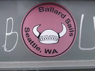 Street sticker Round pink sticker with a Viking helmet graphic and text. It says "Ballard Sails" at the top and "Seattle, WA" at the bottom. Inside the circle is a Viking helmet with the text  "Yah sure, ya betcha"