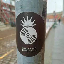 Black and white sticker with a vinyl record design and the text "kollektiv buschtanz".