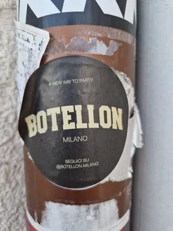 Round black sticker with the text BOTELON MILANO in yellow.  It also says "A new way to party" and has the Instagram handle @BOTELON_MILANO.
