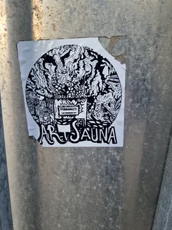 A black and white circular sticker with intricate drawings and the words "Art Sauna" at the bottom.