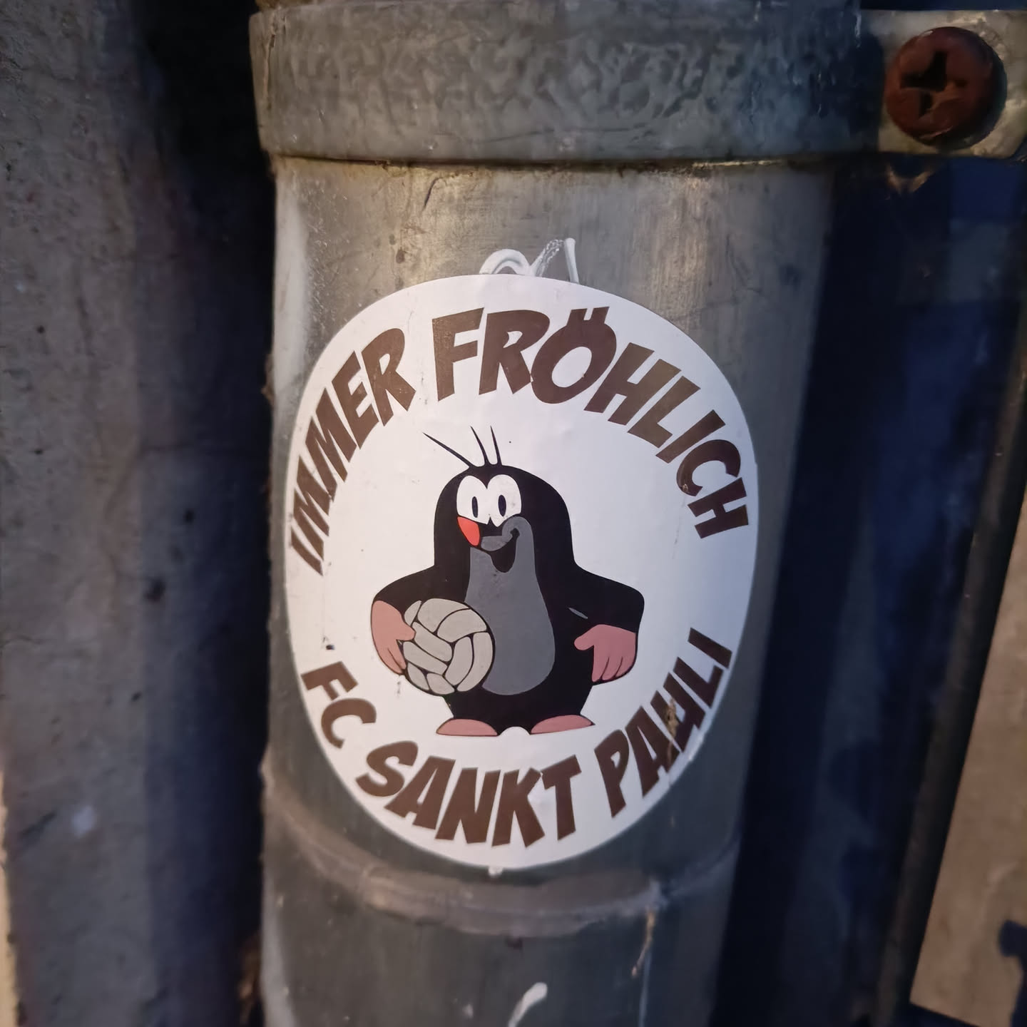 A round sticker featuring Krtek (the Little Mole), a popular Czech cartoon character, holding a volleyball. The text around Krtek says "Immer fröhlich FC Sankt Pauli", which translates to "Always cheerful FC St. Pauli".