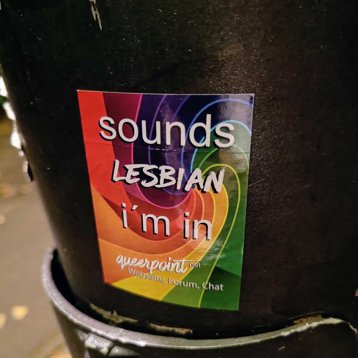 A rainbow sticker with the text "Sounds lesbian i'm in" and the website queerpoint.net at the bottom.  The website offers a forum and chat.