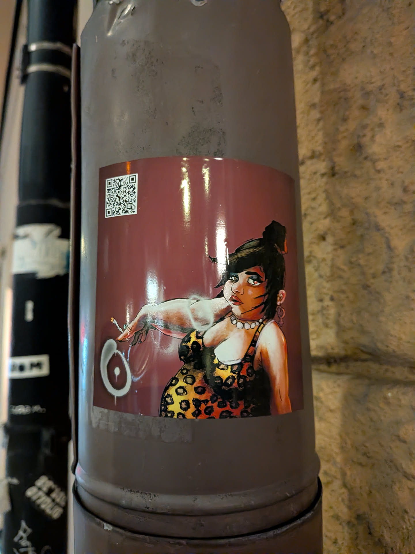 The sticker features a stylized illustration of a woman with dark hair pulled up in a bun, wearing a leopard print dress and a pearl necklace. She has striking green eyes and is holding a lit cigarette in her left hand. The background is a deep maroon color. A QR code is visible in the upper left corner of the sticker.